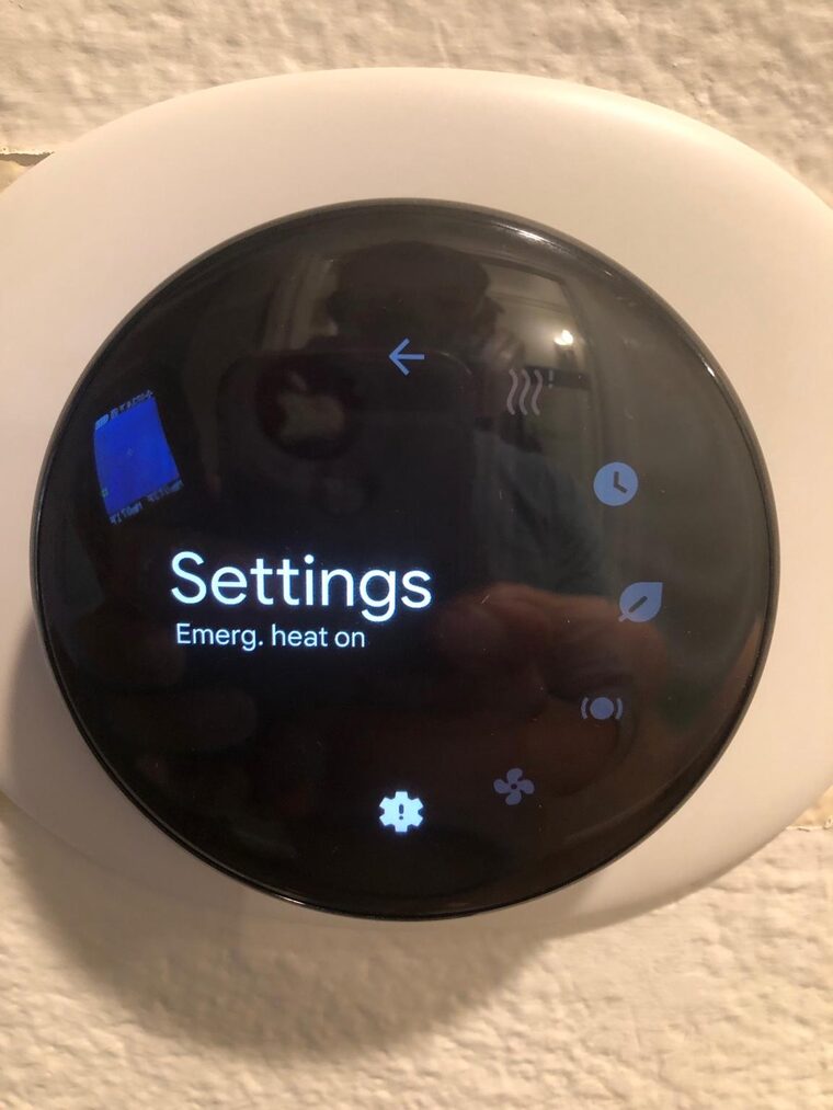 Nest thermostat showing Settings with Emergency heat on confirmation