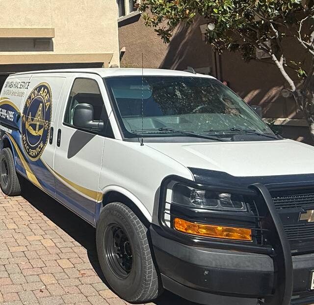 Front and passenger side of the Bay Area HVAC Service van in a residential driveway
