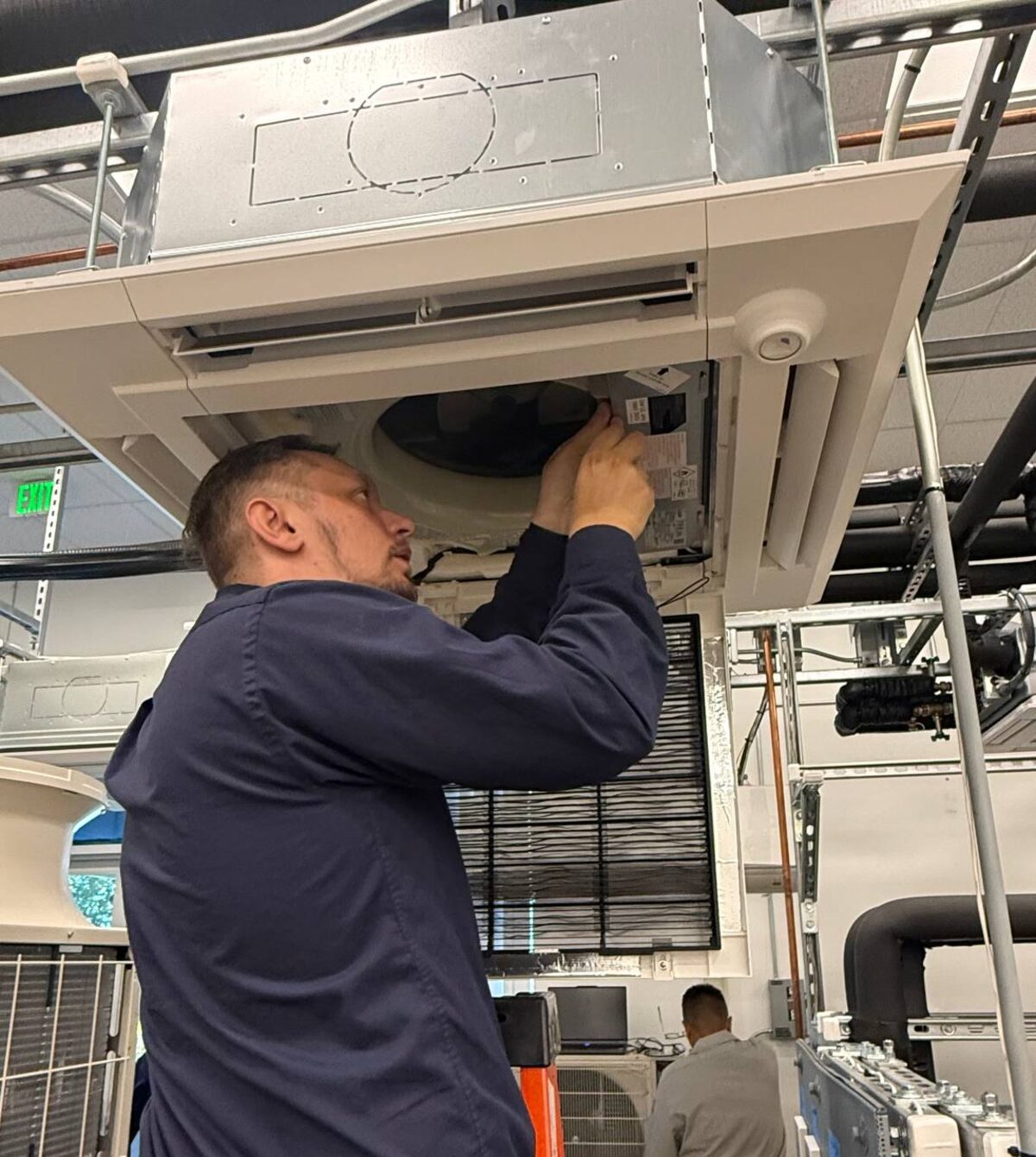 Mitsubishi ceiling cassette indoor unit, opened for service training