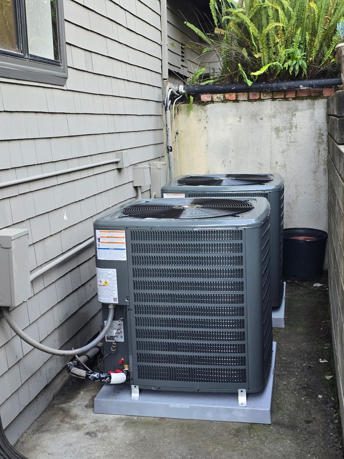 Two new Goodman heat pump condenser units installed side by side, Morgan Hill
