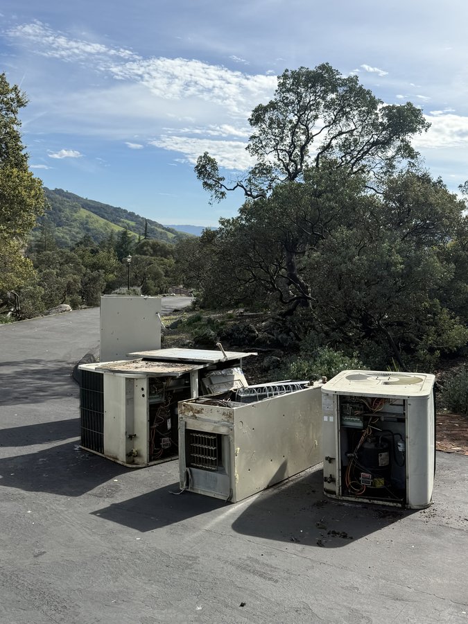 Old HVAC equipment removed and staged for disposal during dual heat pump install, Morgan Hill