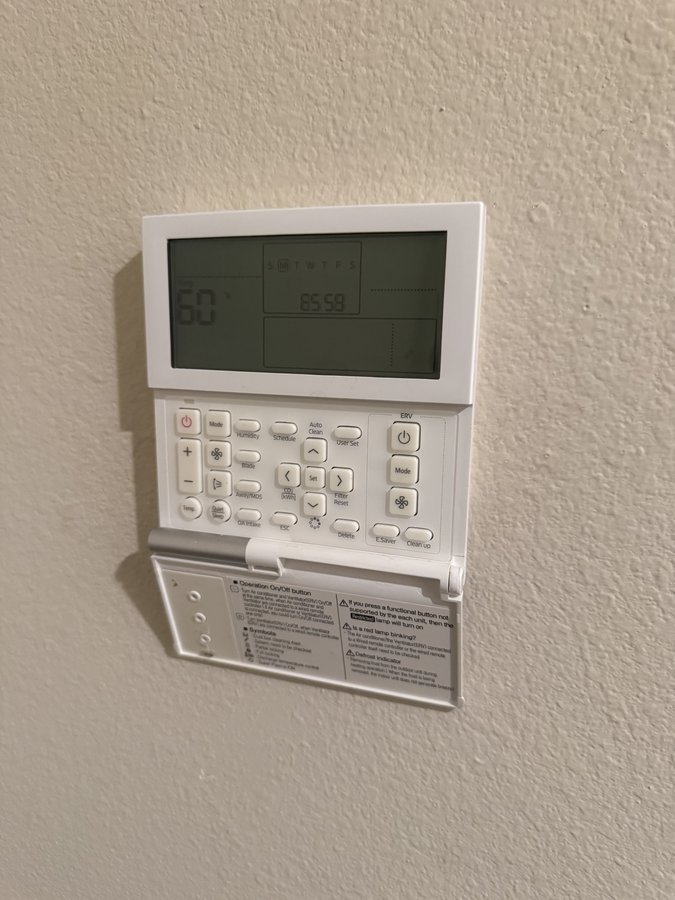 Samsung mini-split wall controller showing setpoint and clock before repair, Pleasanton