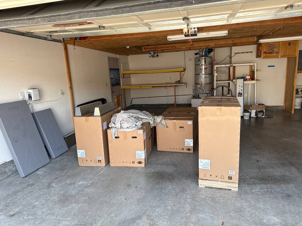 New Carrier heat pump equipment delivered and staged in the garage before installation, San Ramon