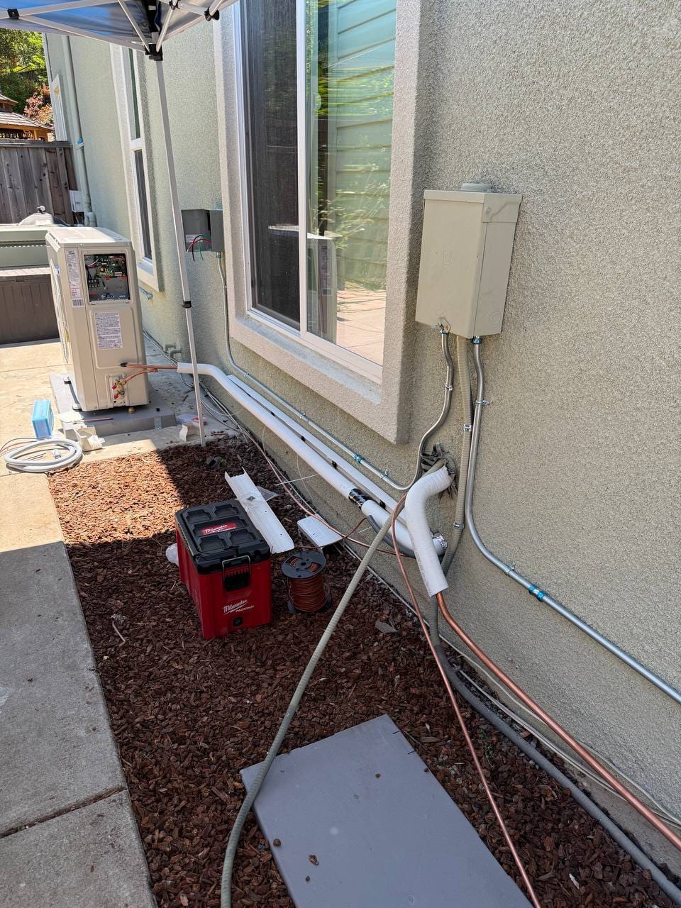 Carrier 19 SEER heat pump installation in progress — refrigerant line installation in San Ramon