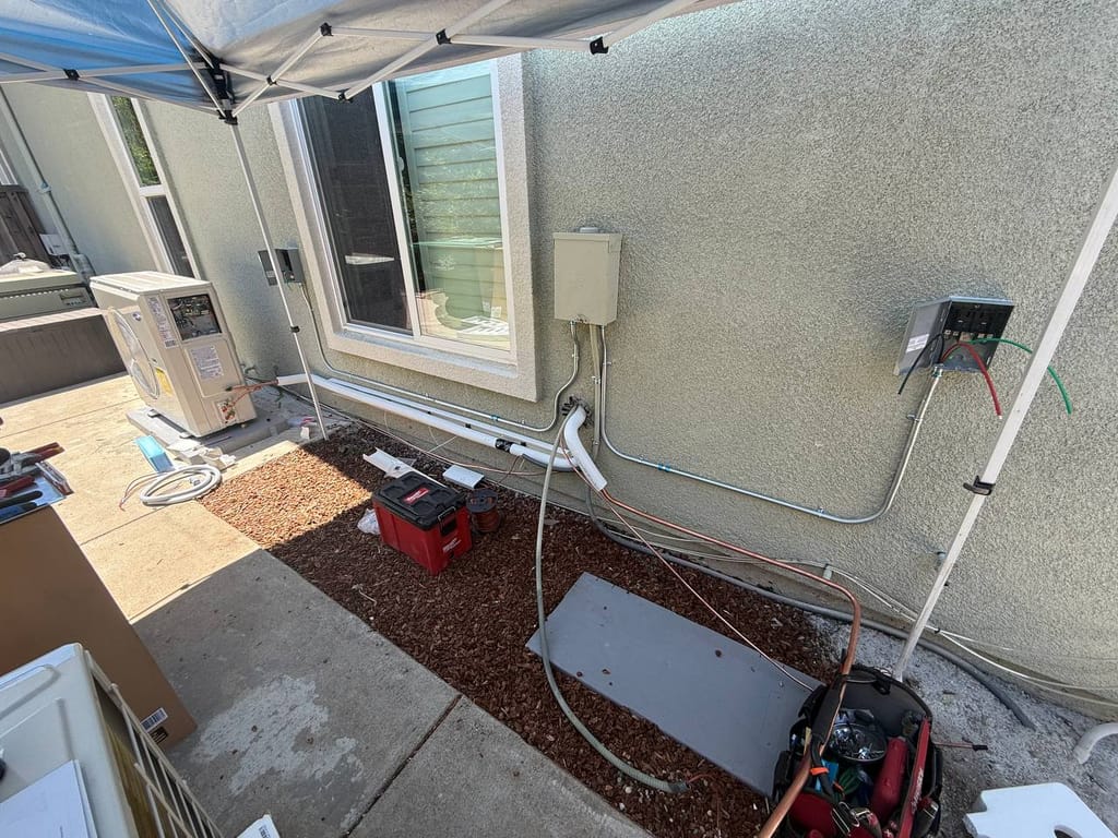 Carrier 19 SEER heat pump installation in progress — refrigerant line installation in San Ramon