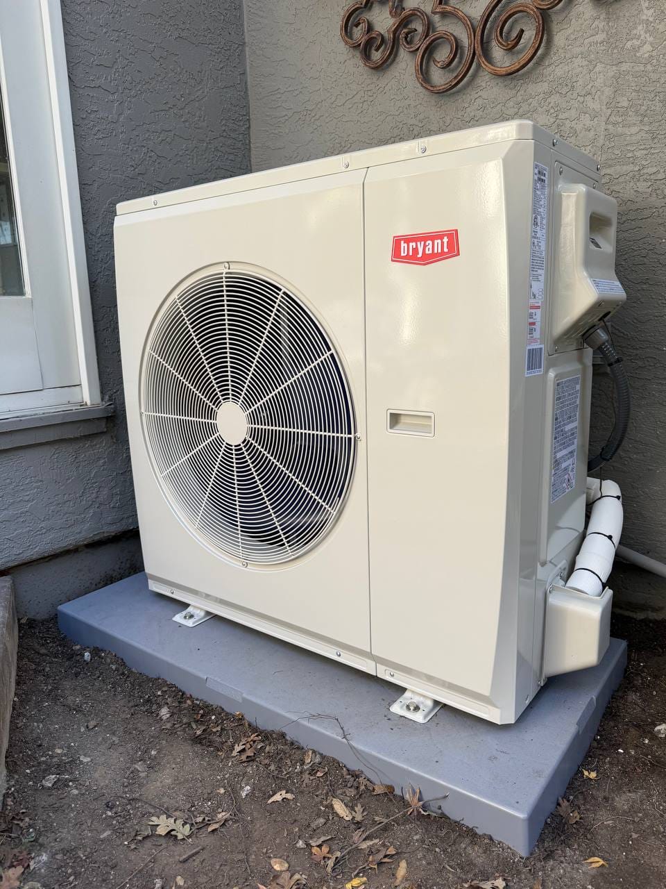 New Bryant 18 SEER2 heat pump condenser installed on new pad, Pleasanton