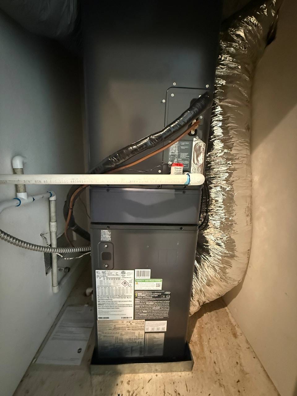 New Bryant air handler with refrigerant line connections during install, Pleasanton