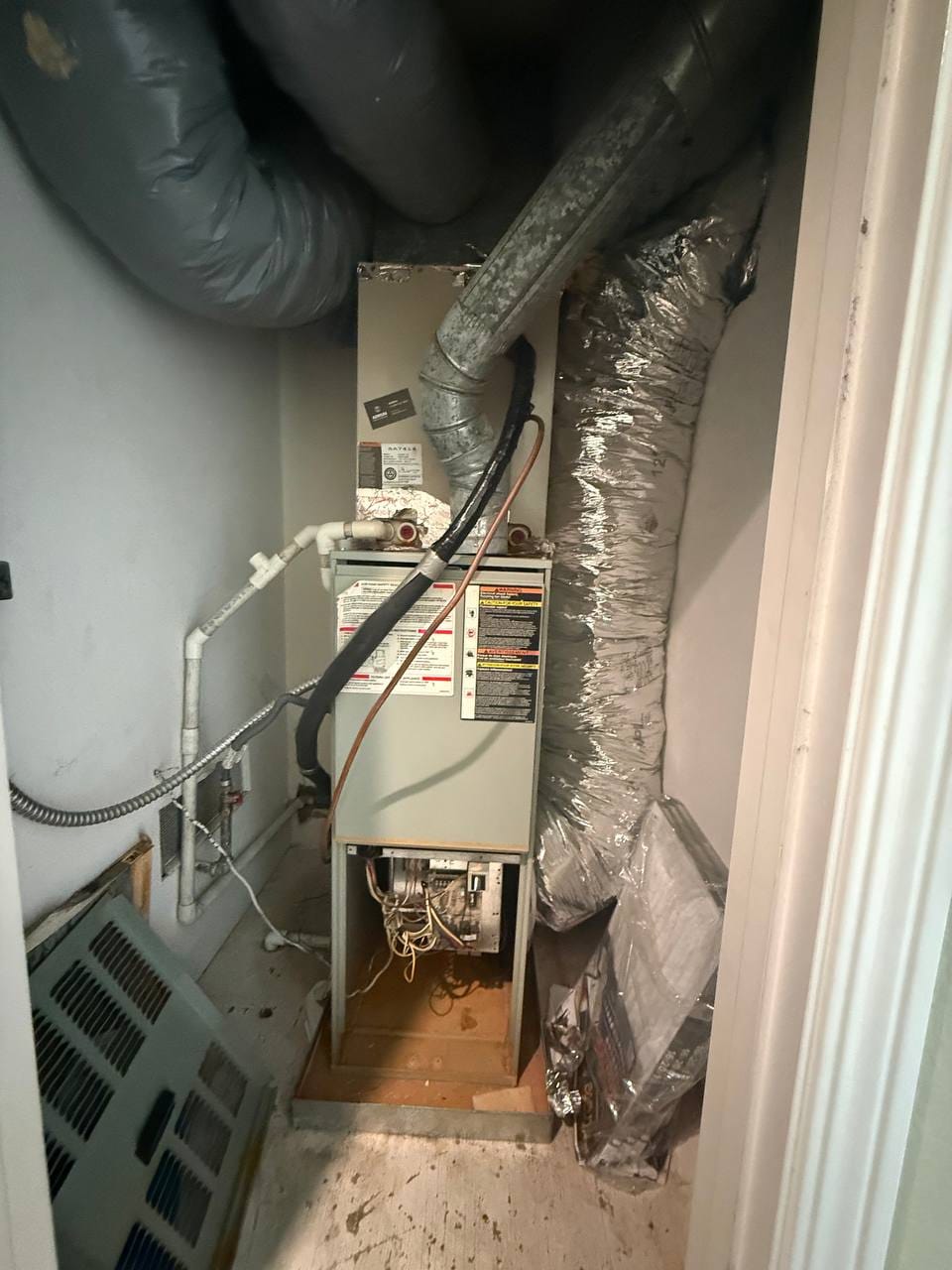 Old indoor air handler disconnected for removal during Bryant install, Pleasanton