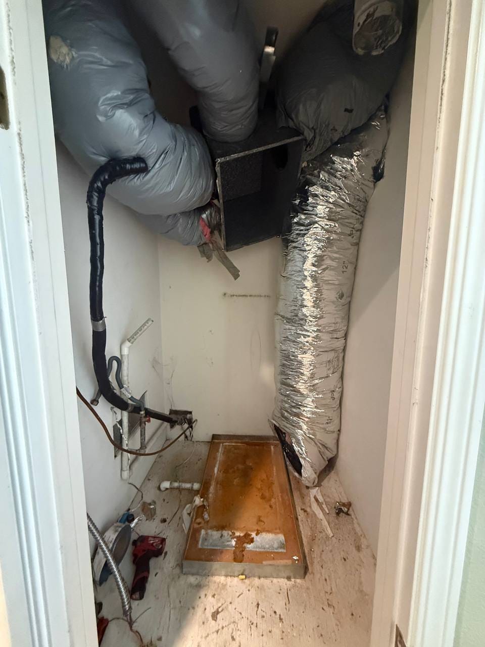 Old air handler removed, ducts and lines disconnected during Bryant install, Pleasanton