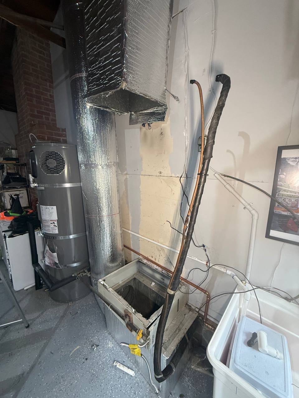 Old indoor furnace removed, lineset and ducting staged for the new air handler, Walnut Creek