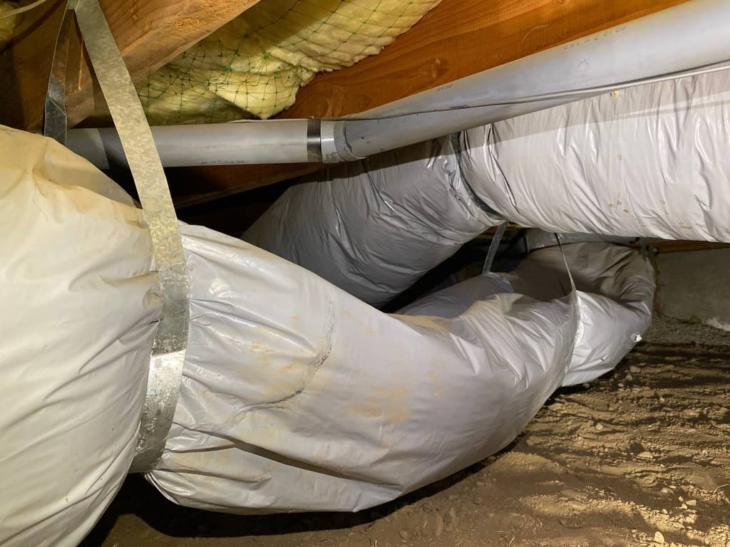 Kinked, sagging flex ducts crimping airflow in the crawl space before repair, Walnut Creek