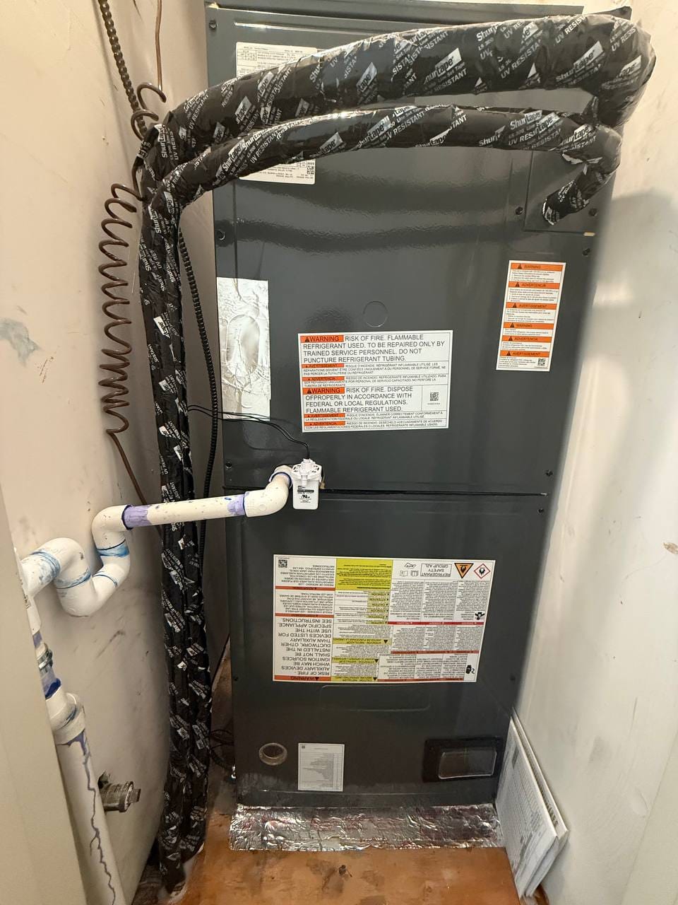 New Goodman indoor air handler set in closet with linesets during installation, Martinez