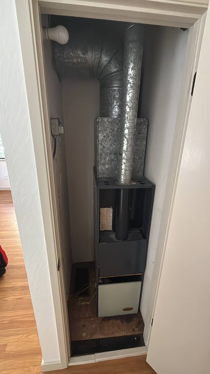 Old indoor gas furnace and galvanized ductwork before removal, Martinez