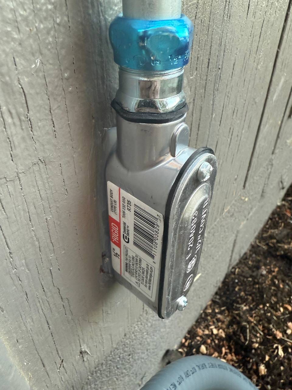 New electrical conduit body and whip connection on exterior wall during installation, Martinez