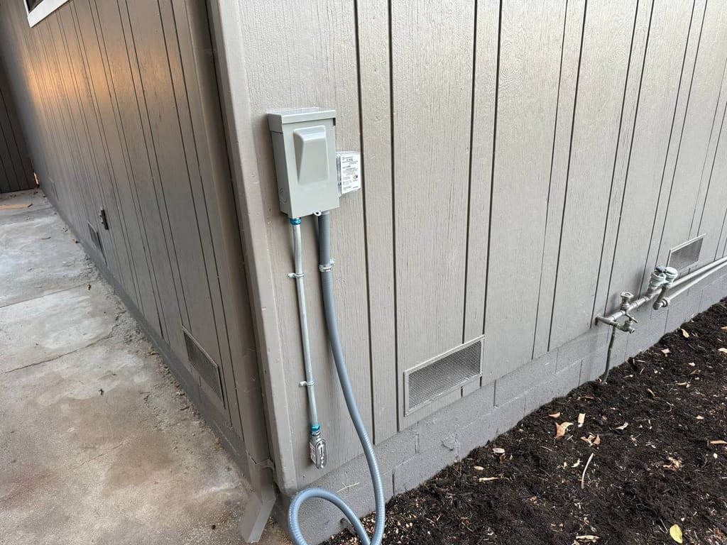 New exterior electrical disconnect box and whip for the condenser during installation, Martinez