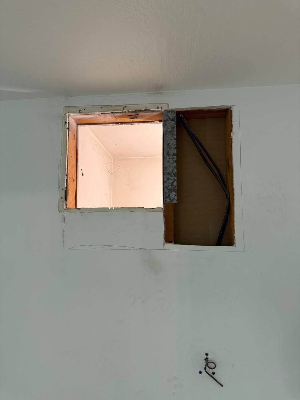 Ceiling access opening cut for line and duct rough-in during installation, Martinez