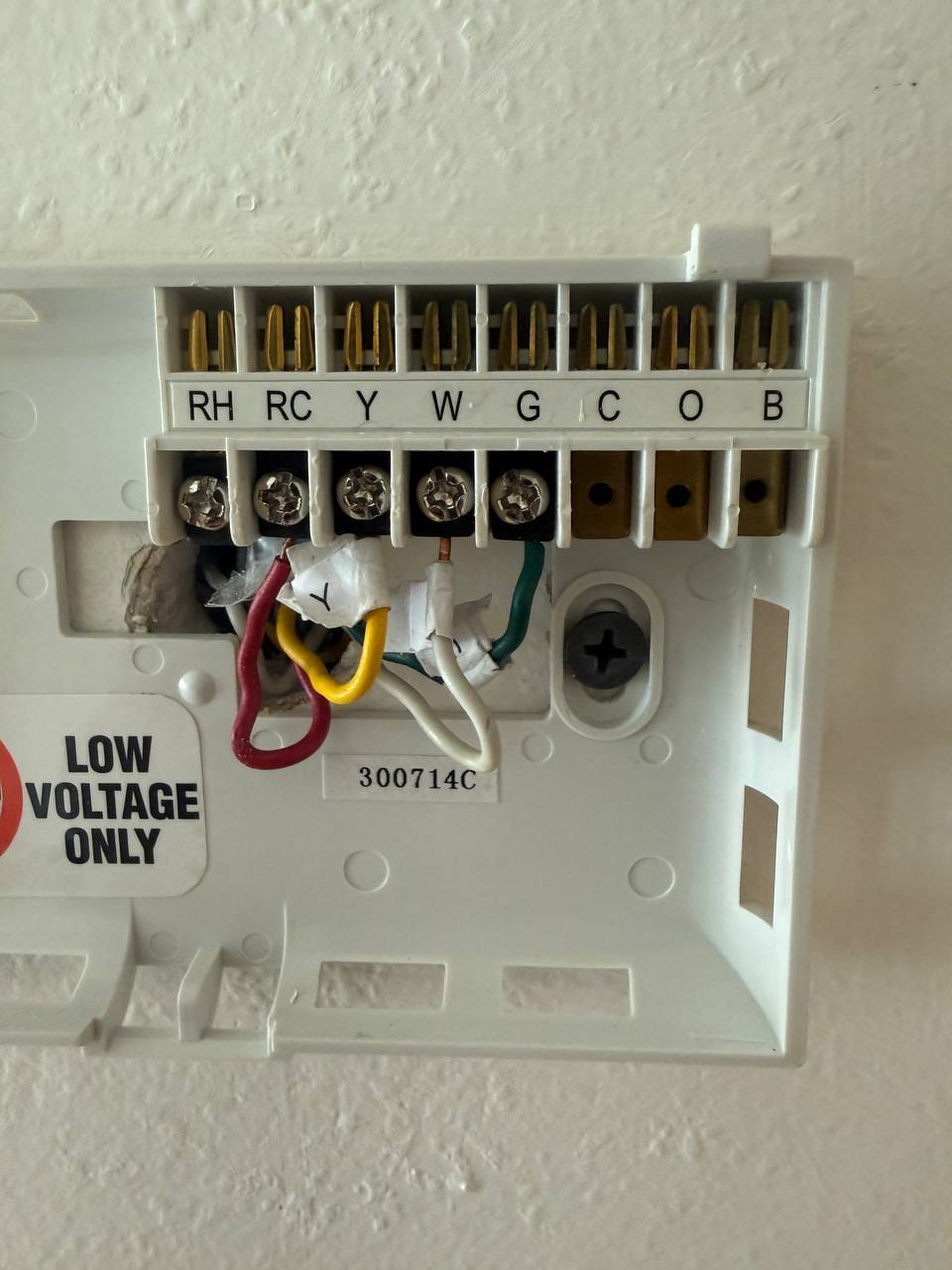 Thermostat subbase exposed with low-voltage control wiring during removal, Walnut Creek