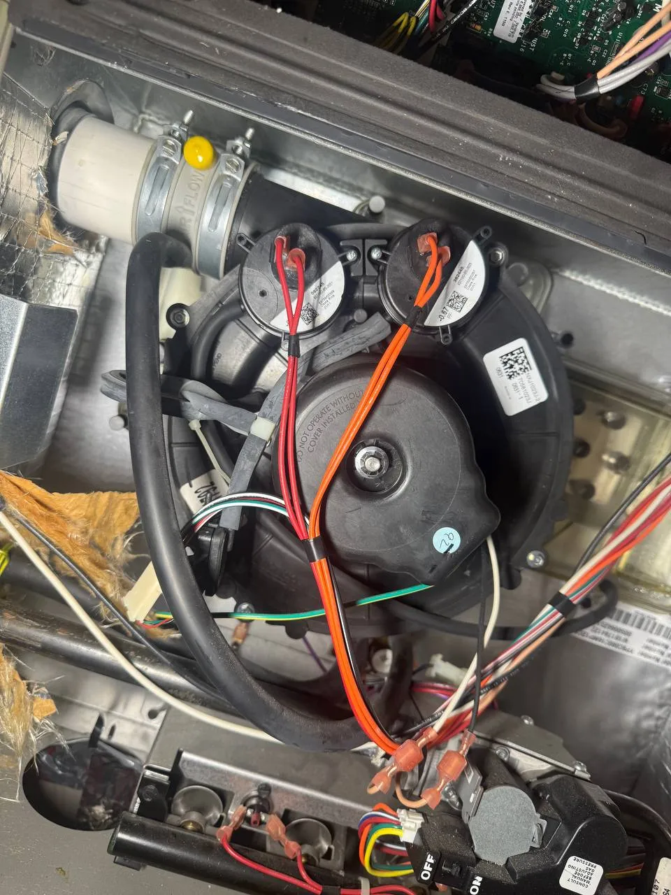 York furnace interior opened, draft inducer and pressure switches exposed during repair, Dublin