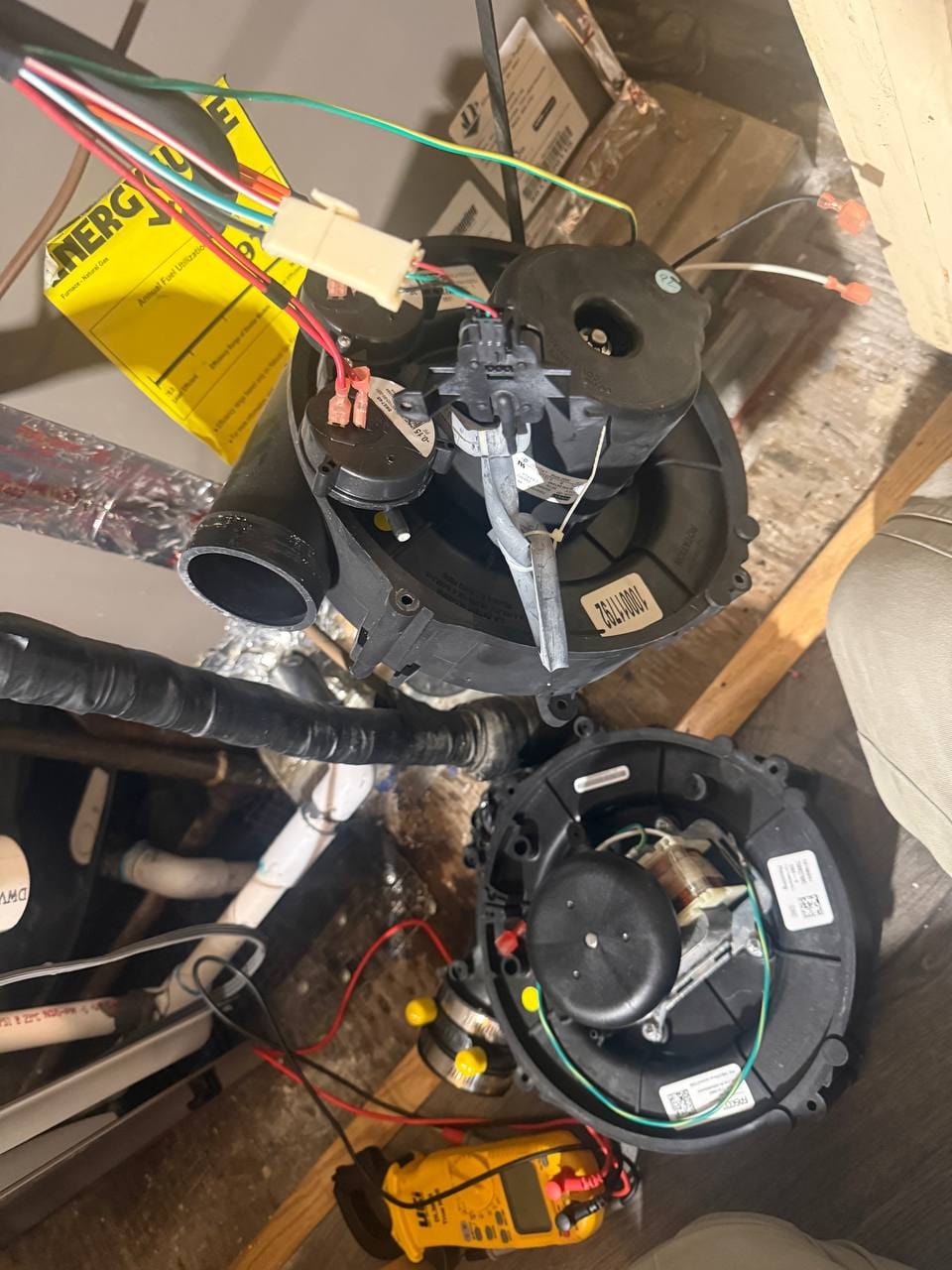 Draft inducer blower assemblies removed for testing with multimeter during York furnace repair, Dublin