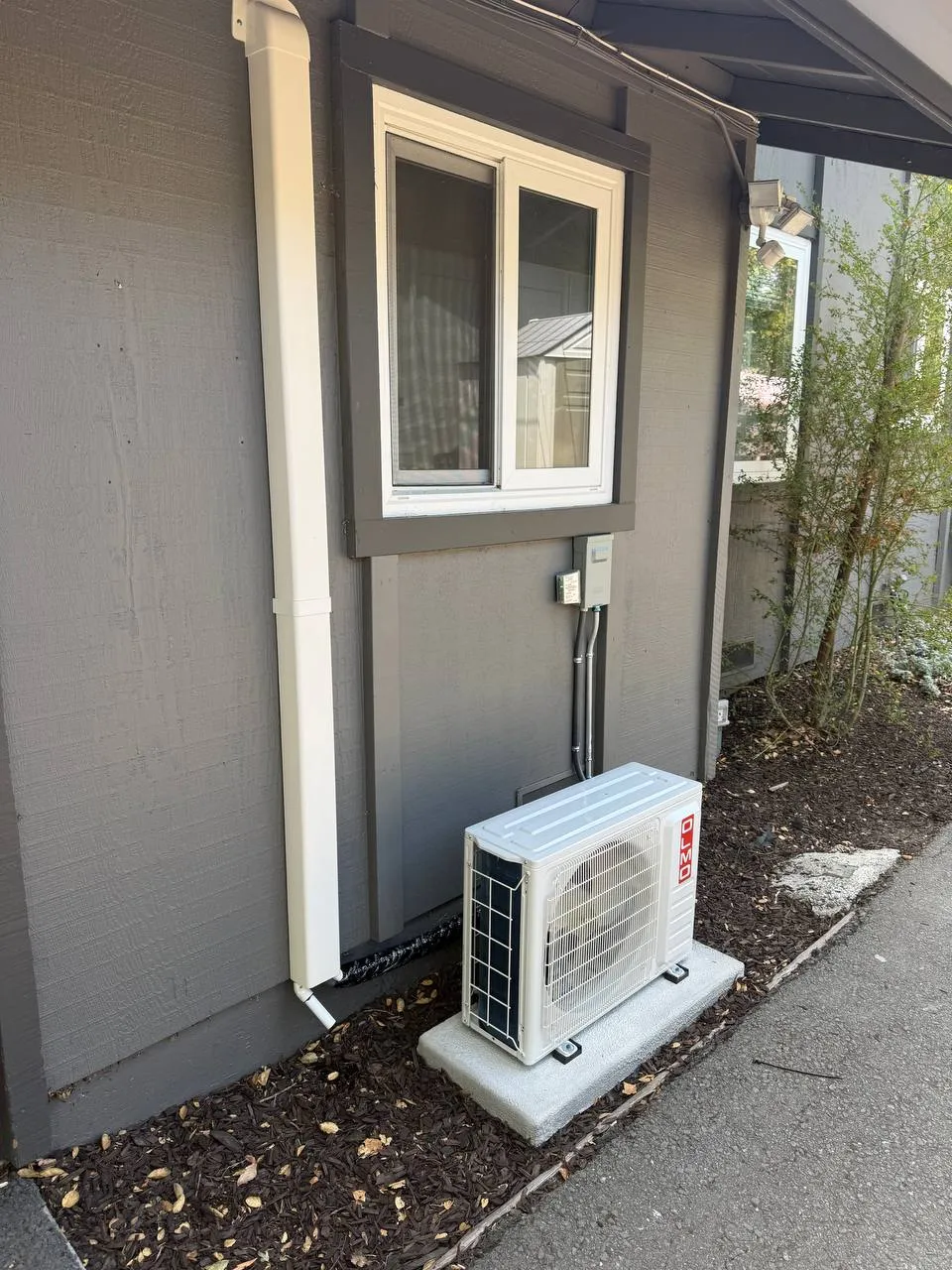 C&H OLMO outdoor unit installed on a concrete pad at a classroom building, The Athenian School, Danville
