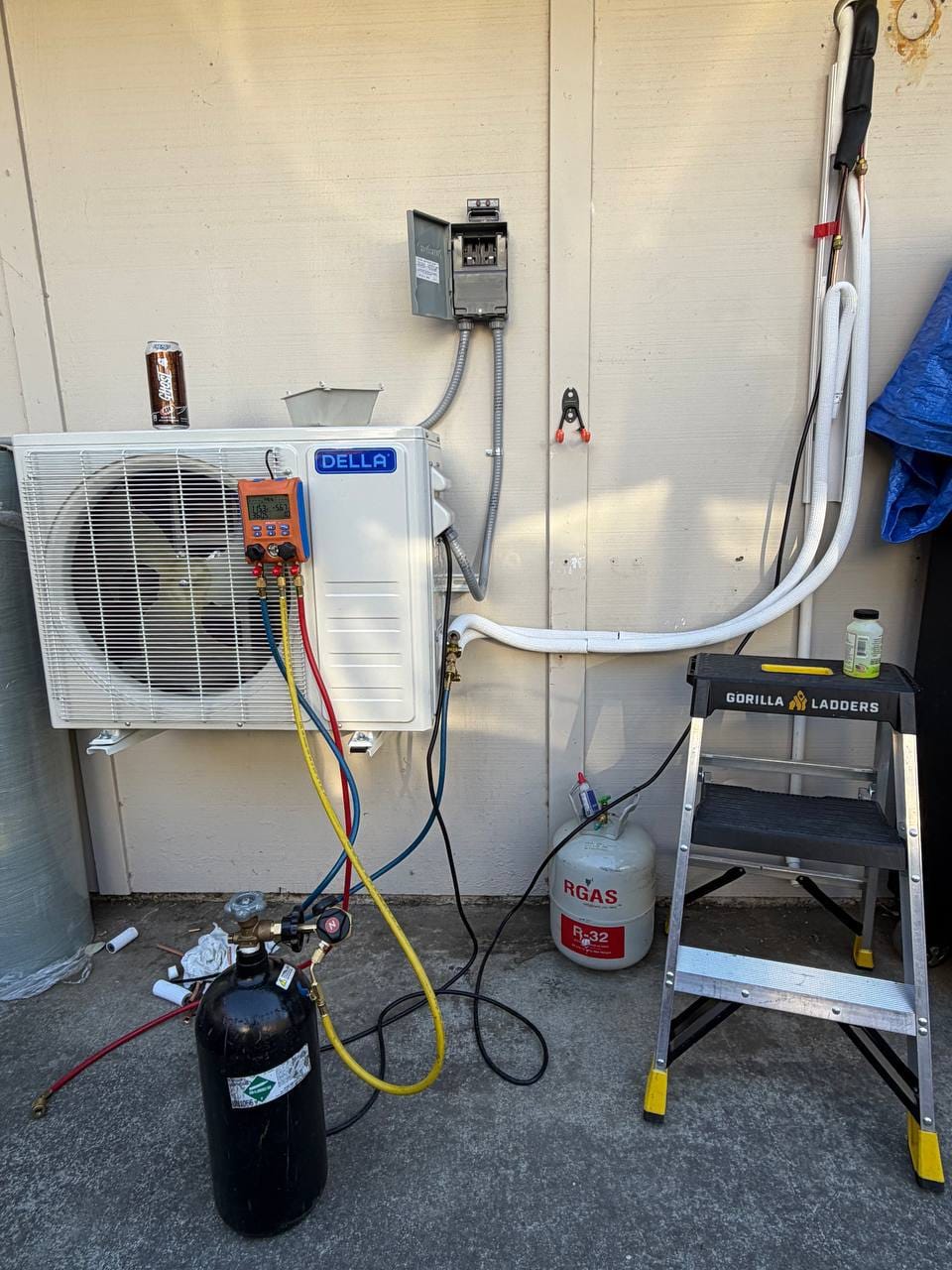 Mini-split installation rework with service gauges and refrigerant equipment connected