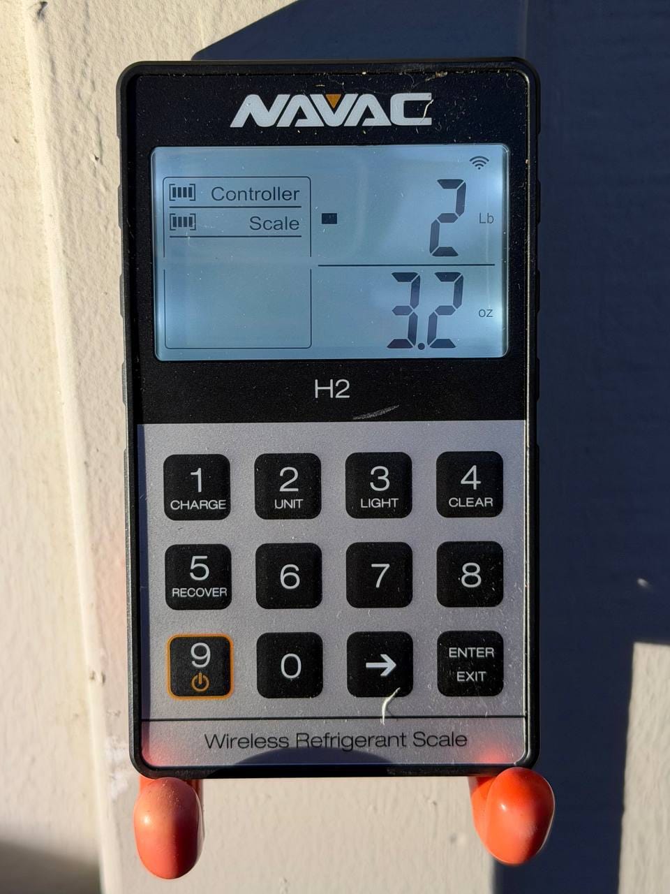 Digital refrigerant scale display used during the Danville mini-split repair