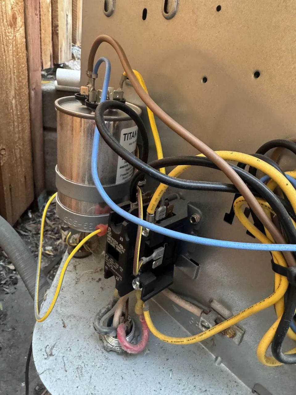 Outdoor Carrier AC unit in Fremont after the repair, with the new dual run capacitor and contactor wired in
