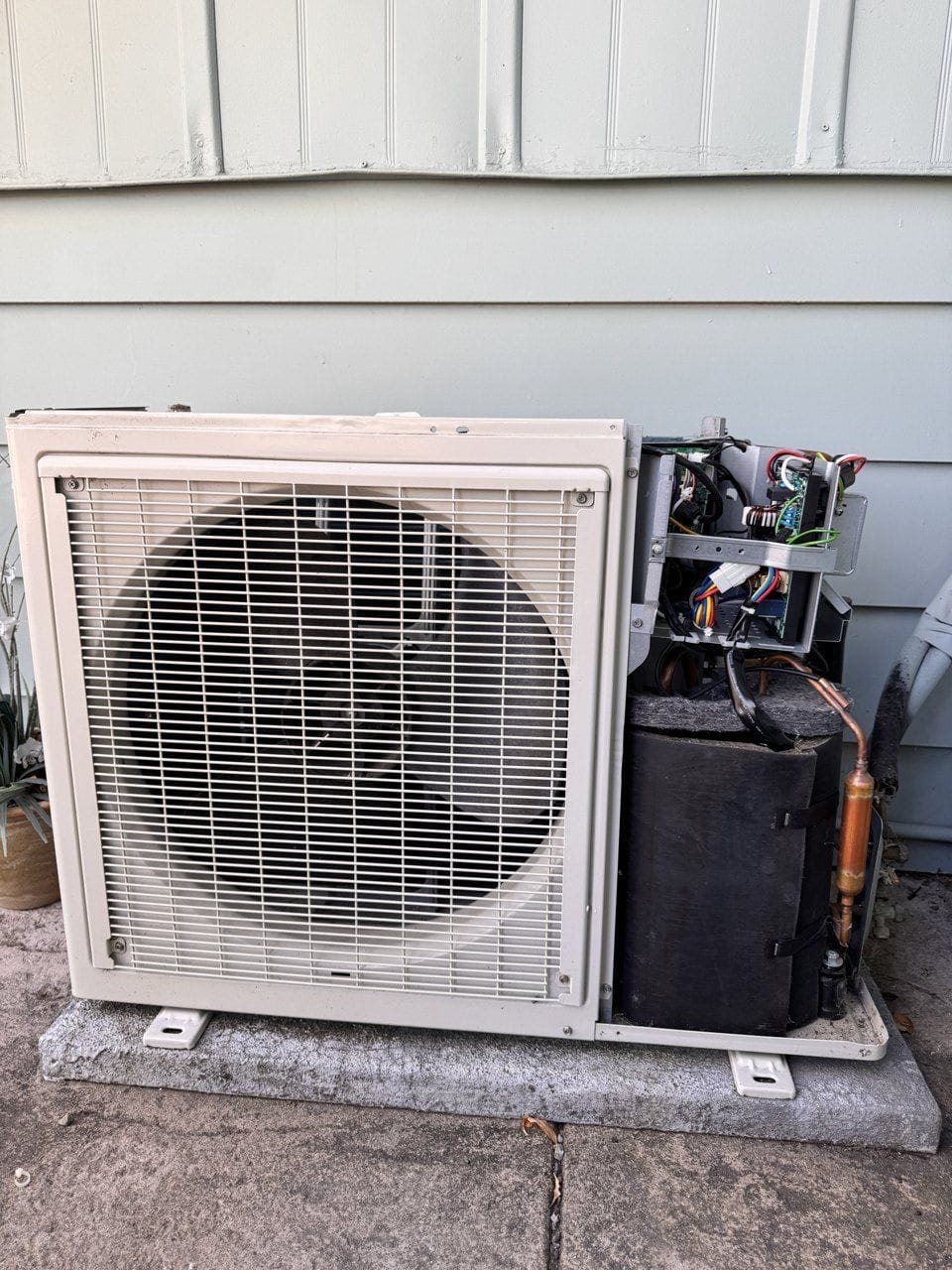 Daikin ductless heat pump outdoor unit in Concord, CA, with the service panel off