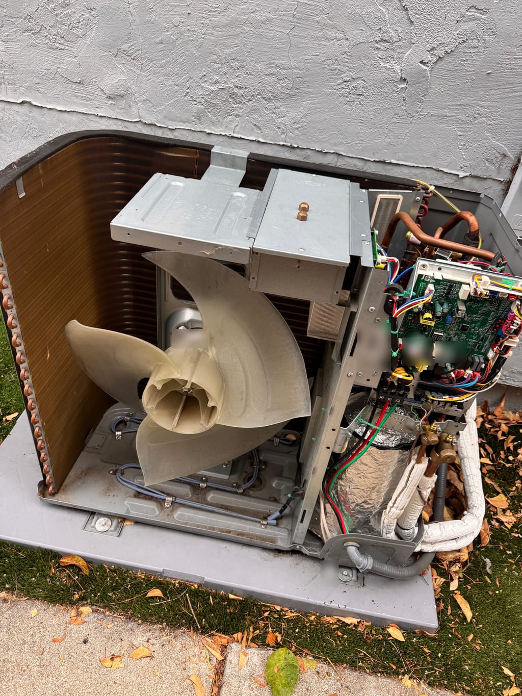 Gree outdoor unit in Concord, CA, with the service panels removed and fan exposed