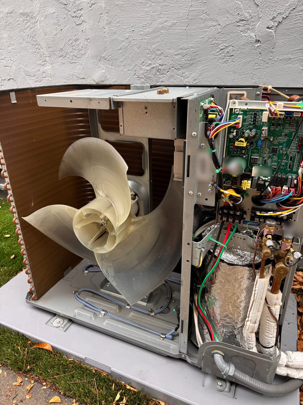 Outdoor coil and fan exposed during service on the Gree unit in Concord, CA
