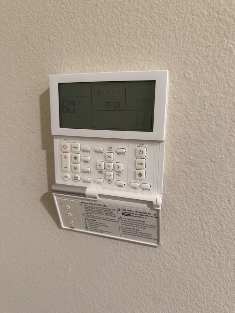 Wall-mounted ductless system controller after a maintenance visit